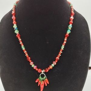 Glass and metal beads with glass chilis pendant